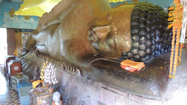 The giant reclining Buddha statue on top of the mountain that has been built around at Phnom Kulen National Park.